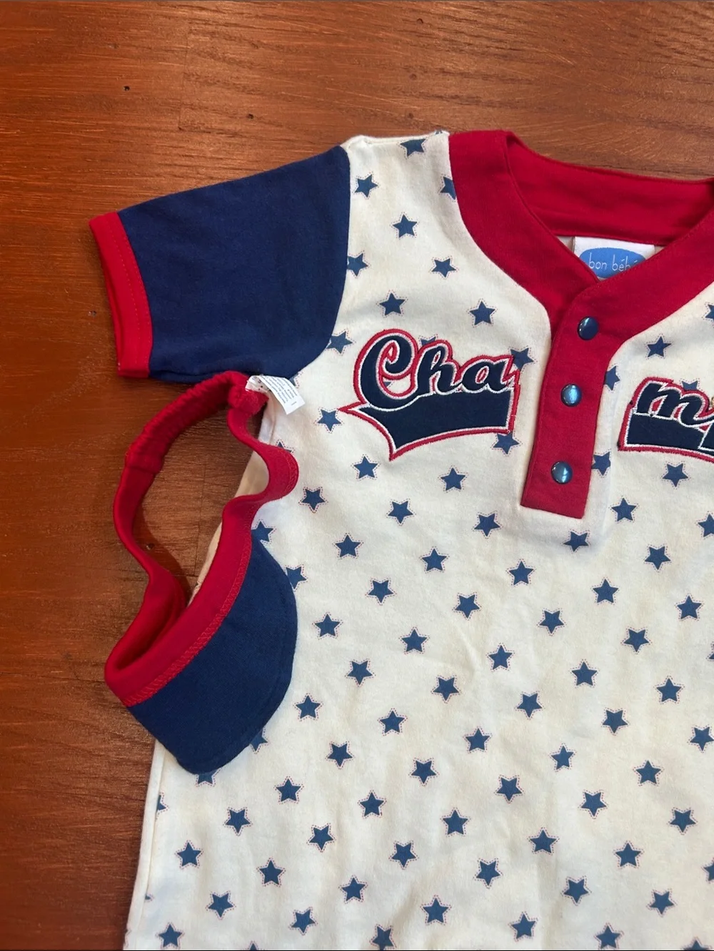 Bon Bebe Cream One-Piece with Navy Stars and Red Trim